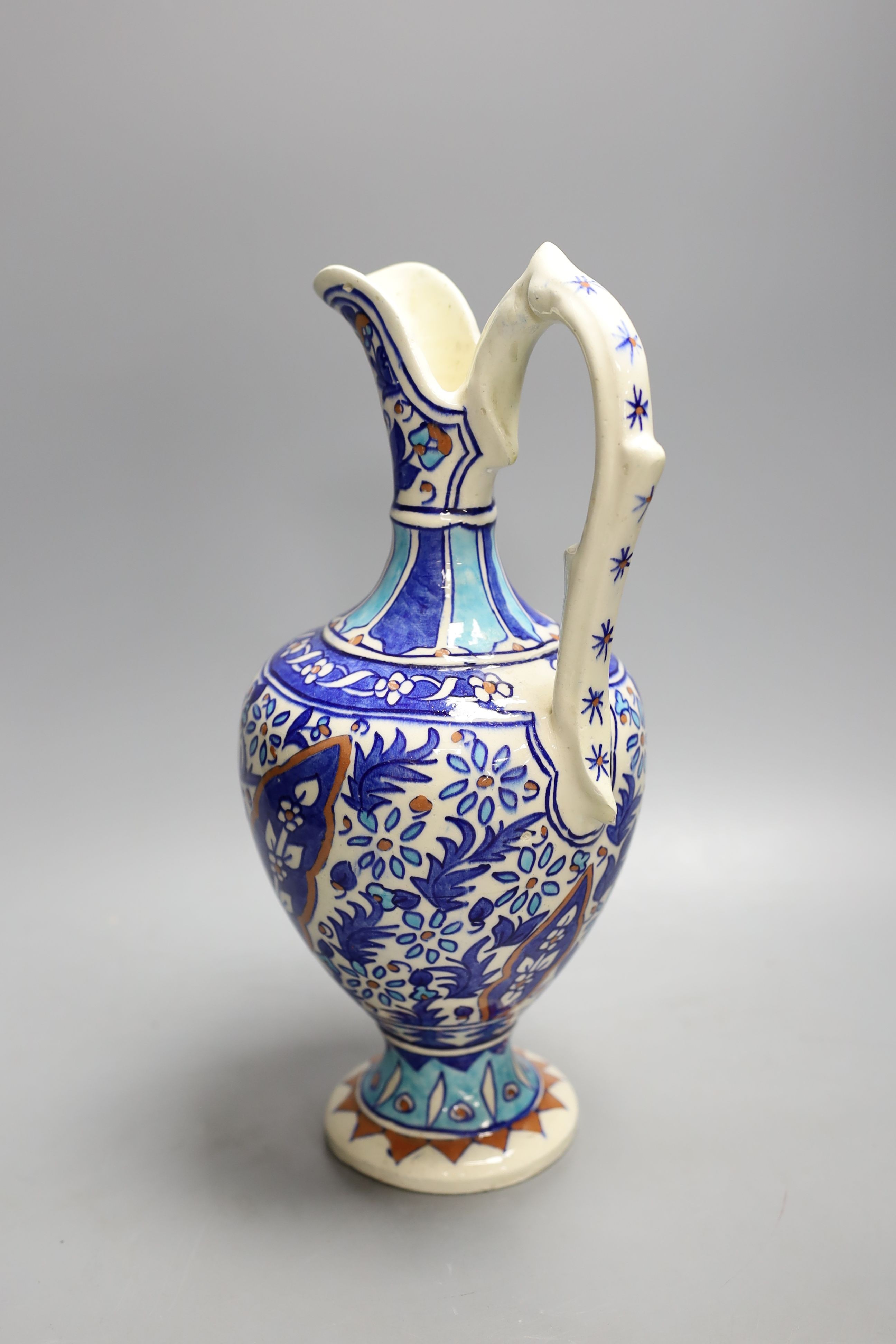 A Turkish Iznik style earthenware ewer, 20th century, 31. 5 cm high
